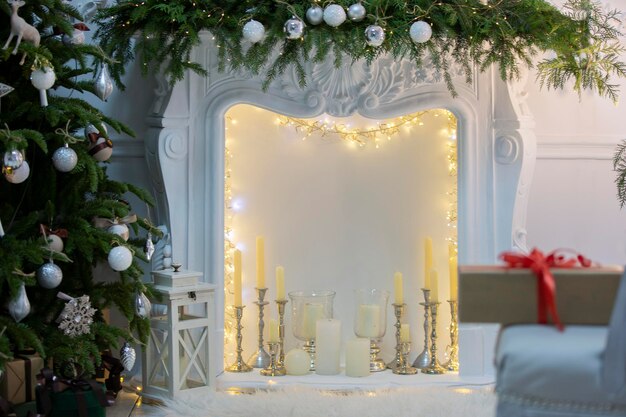 Beautiful Christmas interior of a room or photo studio with a Christmas tree and a fireplace