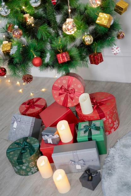 Beautiful Christmas presents under the Christmas tree in the living room