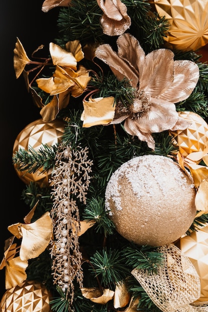 Beautiful Christmas tree decoration, gold flowers and balls, lights, celebration, traditionalal