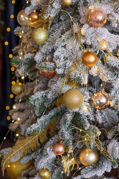 Beautiful Christmas tree with garlands balls and toys Preparing your home for the new year