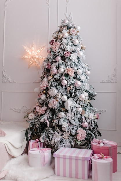 Beautiful Christmas tree with many gifts