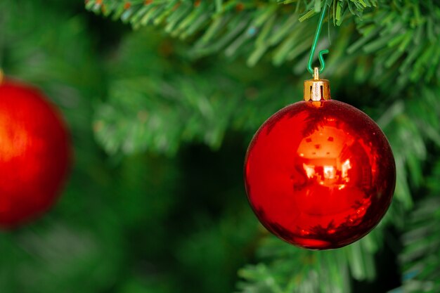 Beautiful Christmas tree with red baubles close up