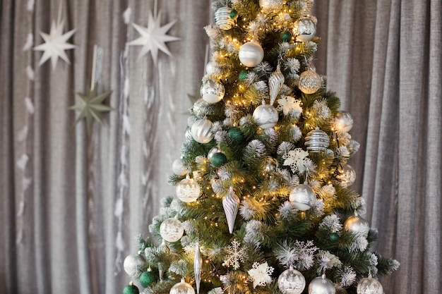 Beautiful Christmas tree with silver decorations