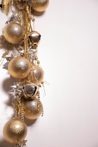 Beautiful christmas wallpaper with christmas arrangement with christmas balls and gold and silver bows fine and chic on white background portrait