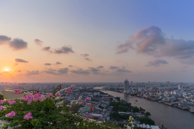 Beautiful cityscape of Bangkok and Chao Phraya river in sunset , Thailand