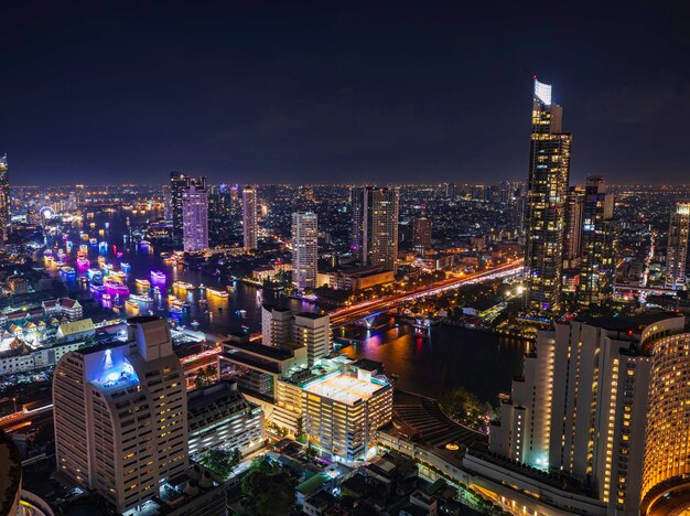 Beautiful cityscape bangkok river boat business district and residential in the twilight