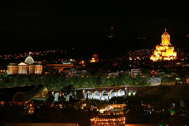 Beautiful Cityscape of Tbilisi at Night with the Presidential Palace and the Holy Trinity Cathedral of Tbilisi, Georgia