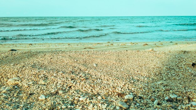 beautiful clear sand and rocks beach background