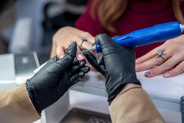 A beautiful client came to the beauty salon for a new manicure during the pandemic Manicure concept during quarantine