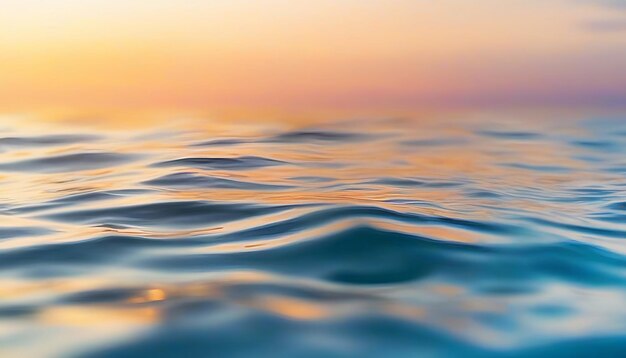 Beautiful closeup sea water surface sunset sunrise gold blue colors calm soft waves relaxing