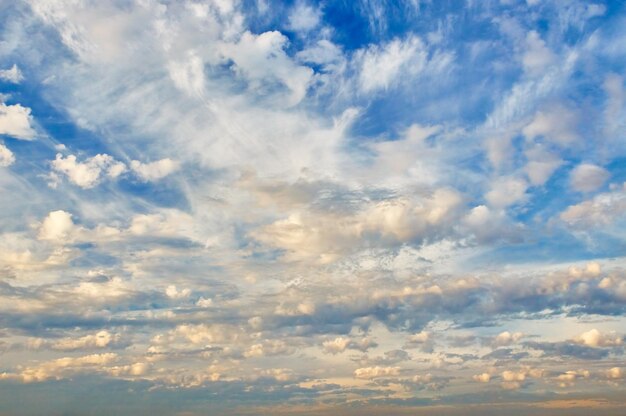 Beautiful cloudy evening sky with sun rays with purple tinge