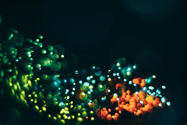 Photo beautiful colored bokeh on a dark abstract background