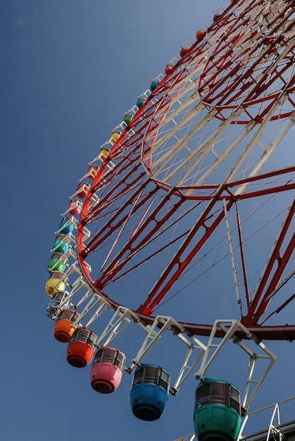 Beautiful colored ferris wheel seen from below