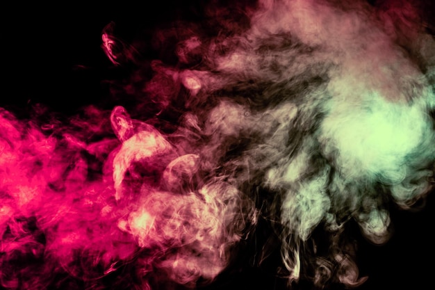 Beautiful column of smoke in the neon bright light of red green pink and turquoise on a black background exhaled out of the vape Nice pattern for printing and backdrop of colored waves