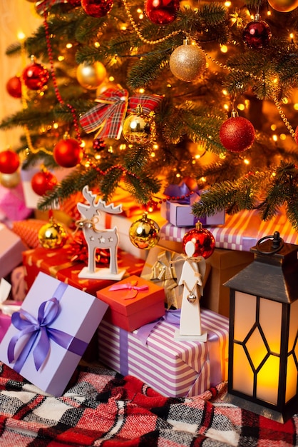 Beautiful composition of presents toys beneath decorated Christmas tree Festive Christmas background