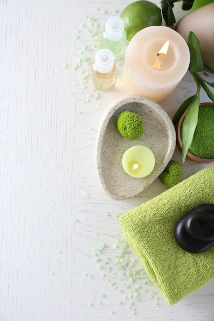 Beautiful composition of spa treatment on white wooden table