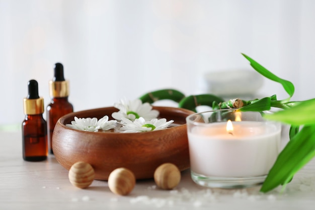 Beautiful composition of spa treatment on wooden table