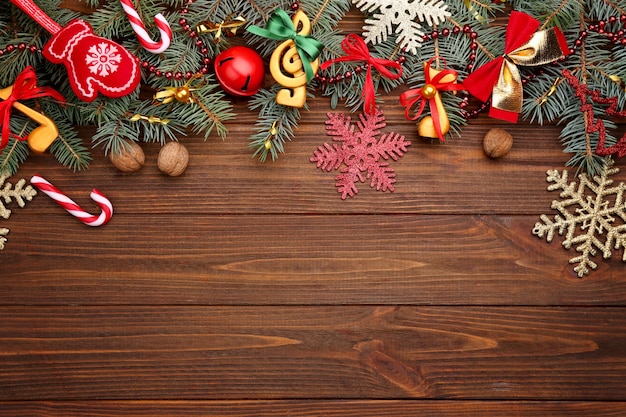 Beautiful composition with fir tree branches and decorations on wooden background. Christmas music concept