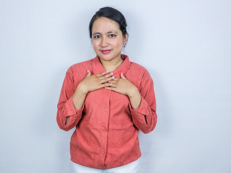 फोटो beautiful confident asian business woman holding hands on chest isolated portrait