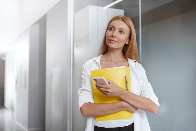 Beautiful confident businesswoman looking away