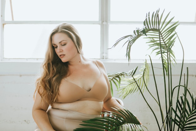 Premium Photo | Beautiful and confident plus size woman in nude underwear