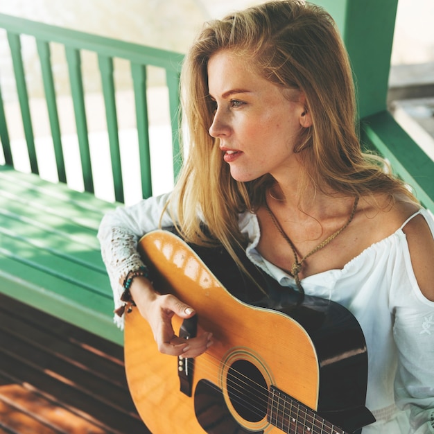 Beautiful country girl with her guitar