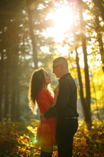 Beautiful couple in the autumn forest