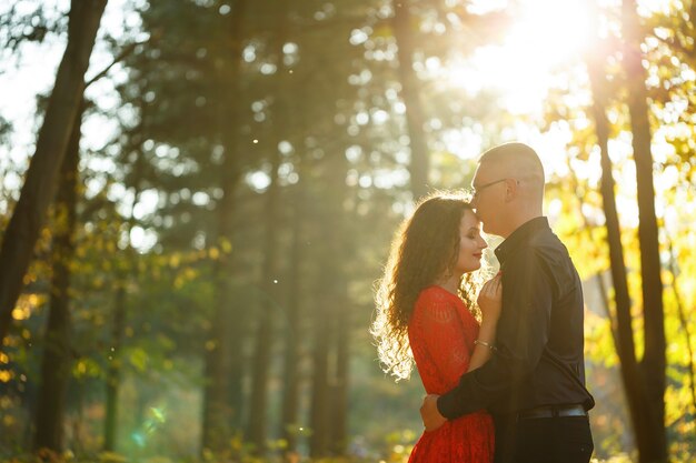 Beautiful couple in the autumn forest