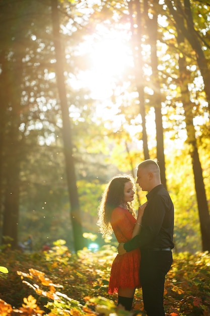 Beautiful couple in the autumn forest