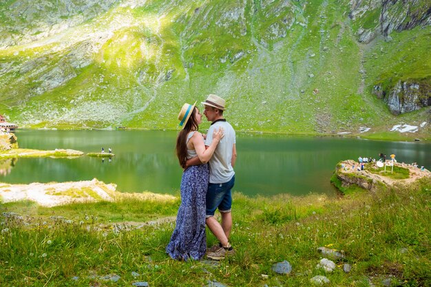 A beautiful couple before kiss near of Lake Balea