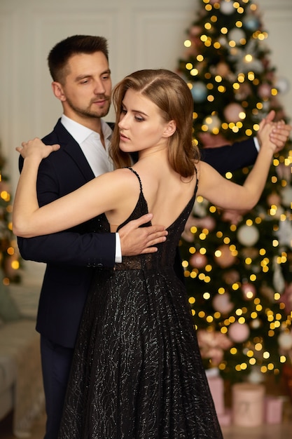 Beautiful couple dancing in the living room