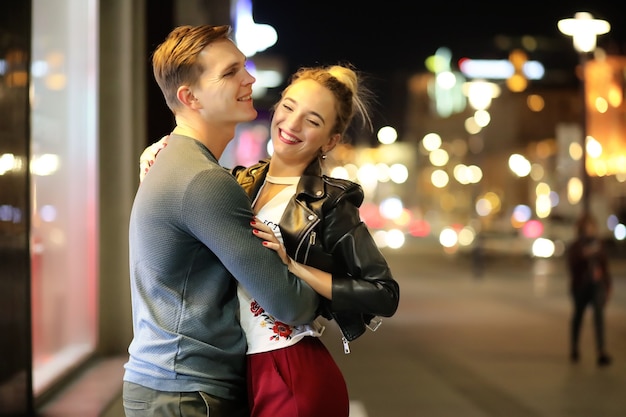 Beautiful couple on a date in a night city outdoor