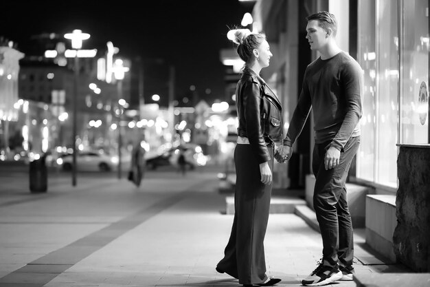 Beautiful couple on a date in a night city outdoor