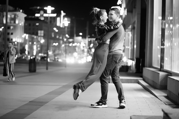 Beautiful couple on a date in a night city outdoor