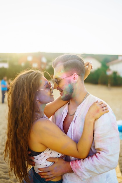 Beautiful couple enjoy each other on Holi festival Friendship Leisure Vacation Togetherness