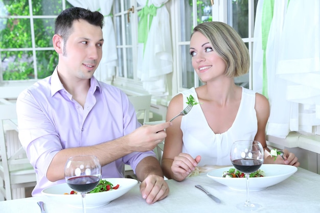 Beautiful couple having  romantic dinner at restaurant