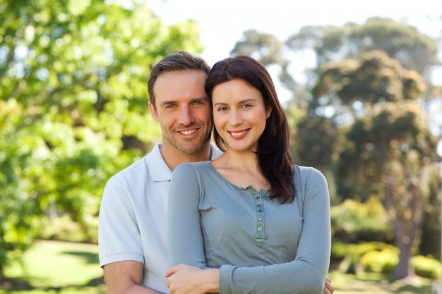 Beautiful couple hugging in the park