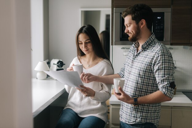 Beautiful couple is reading documents