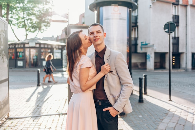 Beautiful couple kissing on the street 