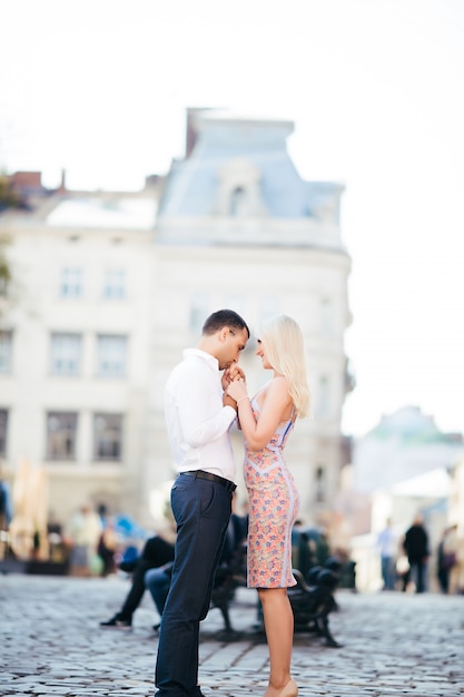 Beautiful couple in love dating outdoors and smiling