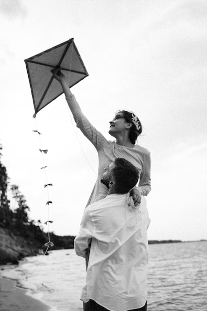 Beautiful couple in love on a lake beach