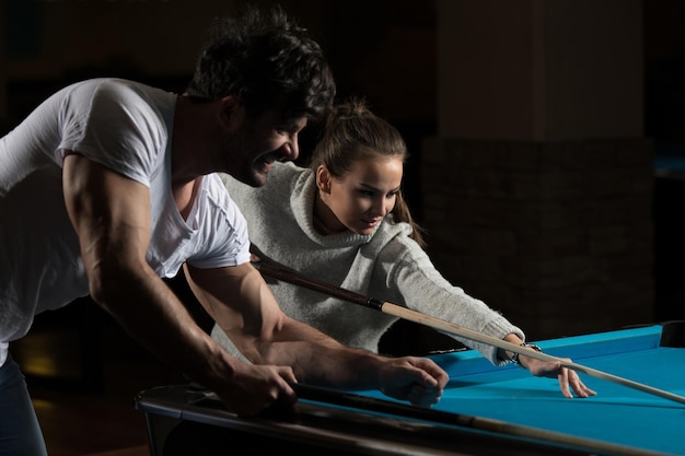 Beautiful Couple Playing Pool