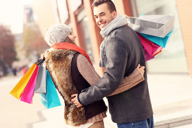 a beautiful couple shopping together in the city