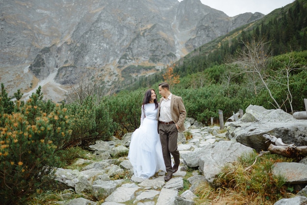 Beautiful couple walking among rocks