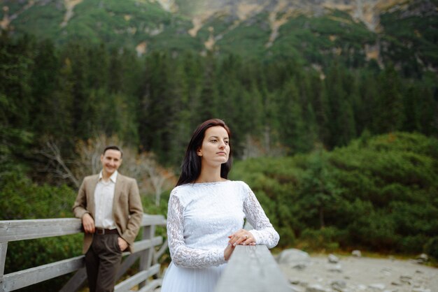 Beautiful couple walking among rocks