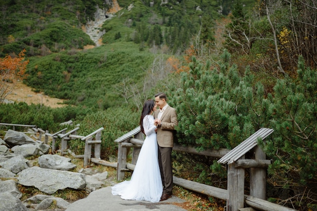 Beautiful couple walking among rocks