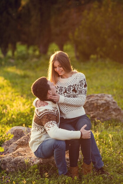 Beautiful couple walks in the autumn in nature, real sincere feelings