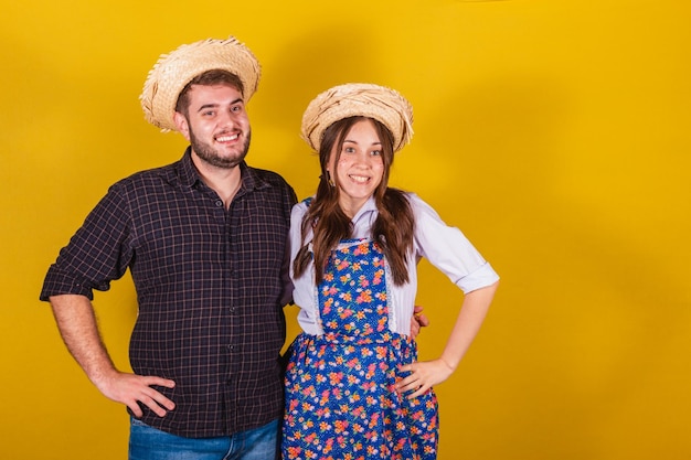 Beautiful couple wearing typical clothes for the Festa Junina Smiling happy