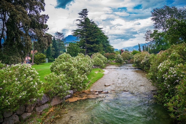 Beautiful cozy green town park in Riva del Garda on Garda lake, Italy