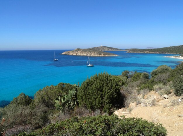 Beautiful crystal clear sea water and beach in Sardinia island Sardegna Italy